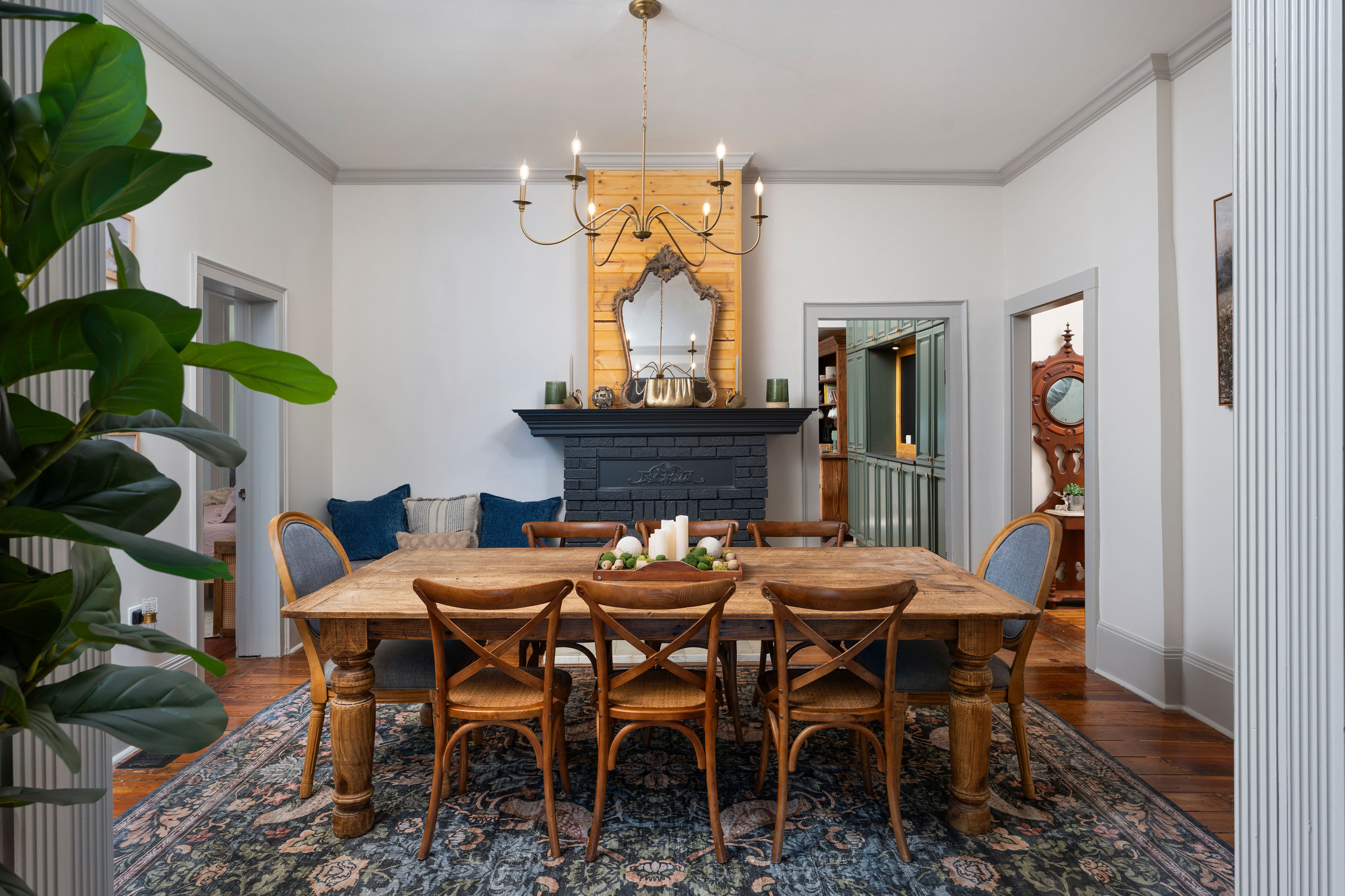 Farmhouse dining room with antique mirror