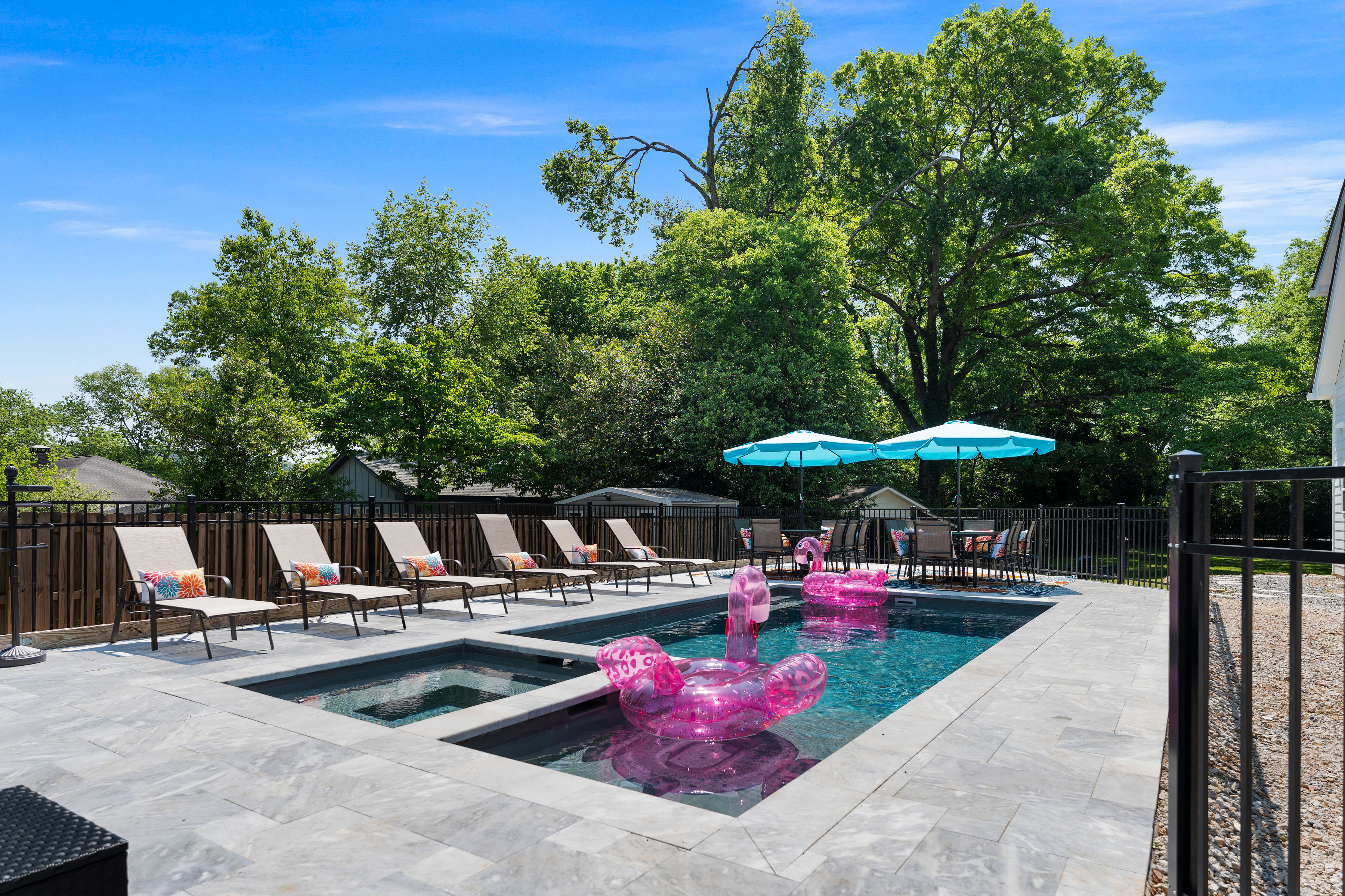 Pool with sun loungers and umbrellas